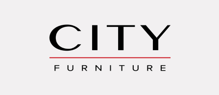 The City Furniture logo on a white background. 'CITY' appears in large bold black uppercase letters with 'FURNITURE' in smaller uppercase gray letters beneath, separated by a thin dark red horizontal line.