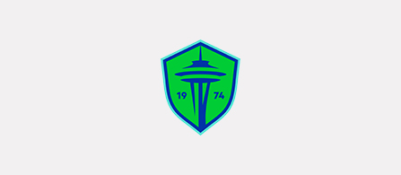 The Seattle Sounders FC logo featuring a green and blue shield icon with a Space Needle graphic, alongside the text Seattle Sounders FC in dark blue on a white background.