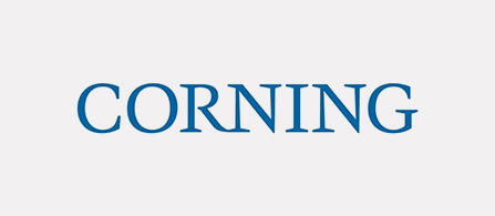 A logo centered on a light gray background. The word “CORNING” appears in blue serif capital letters.