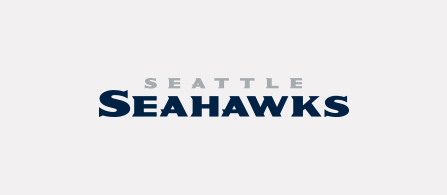 The Seattle Seahawks wordmark logo on a white background. 'SEATTLE' appears in gray text above 'SEAHAWKS' in large, bold dark navy blue letters.