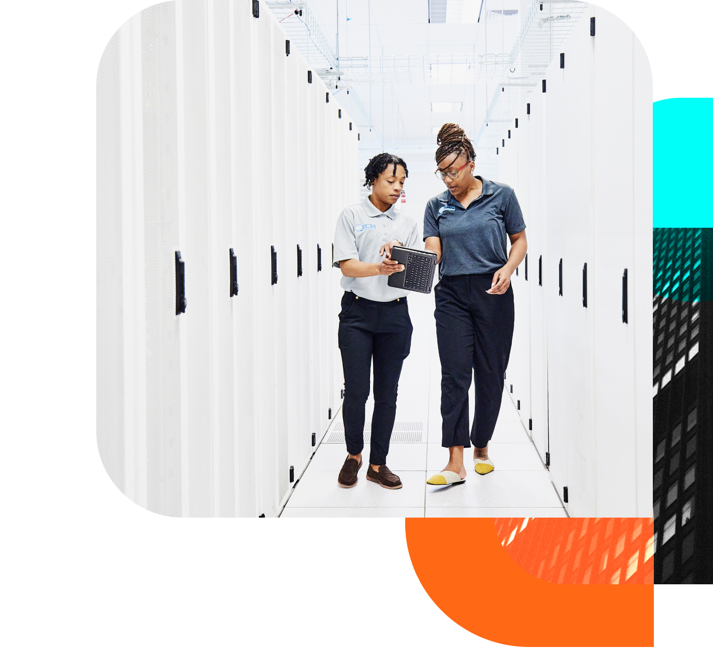 Two IT professionals examine a tablet in a well-lit server room.  