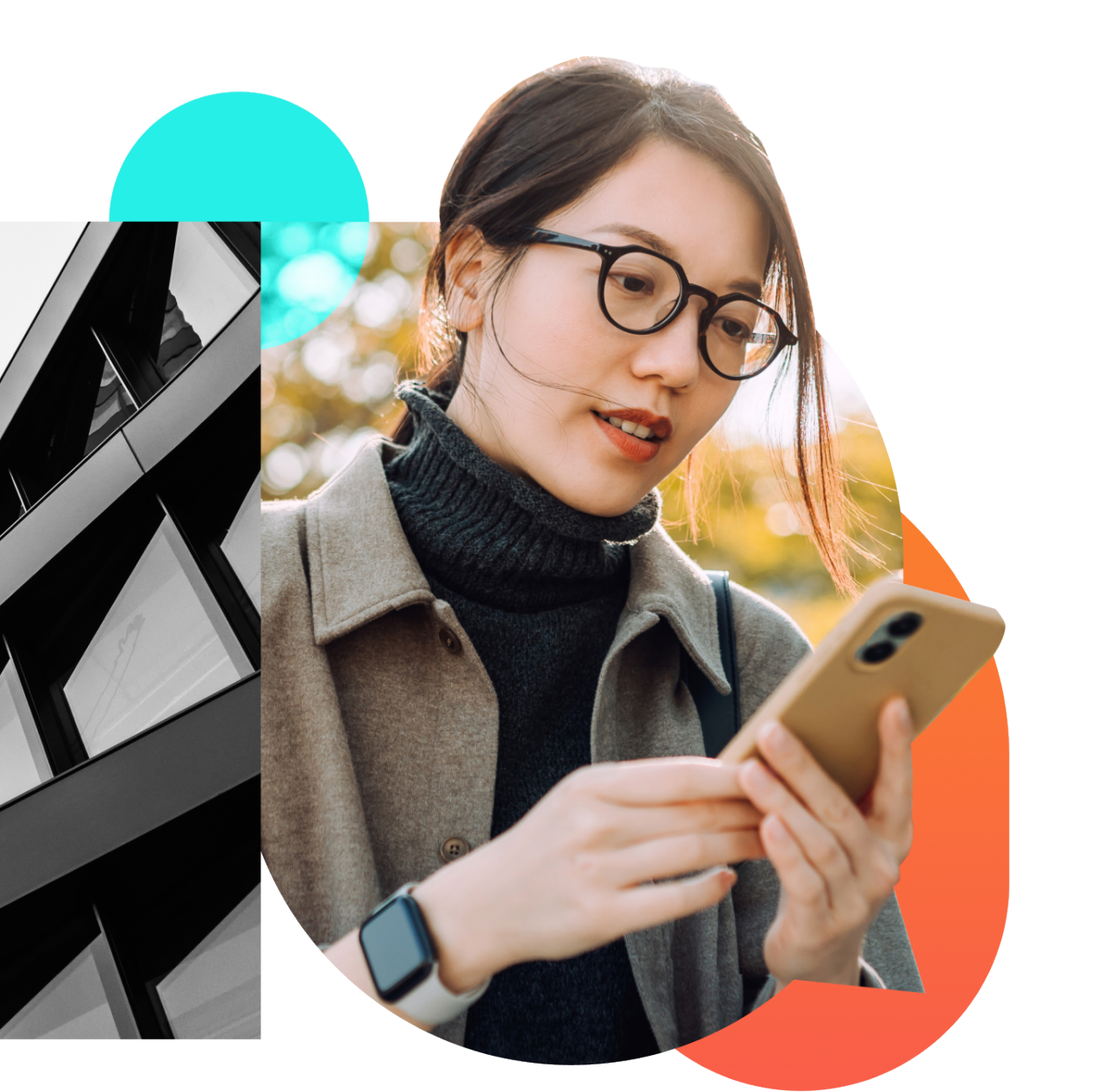 A young woman in glasses looks at her phone outside while the wind gently blows her hair.  