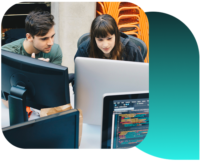 Two professionals having an animated discussion on an elevated walkway. 