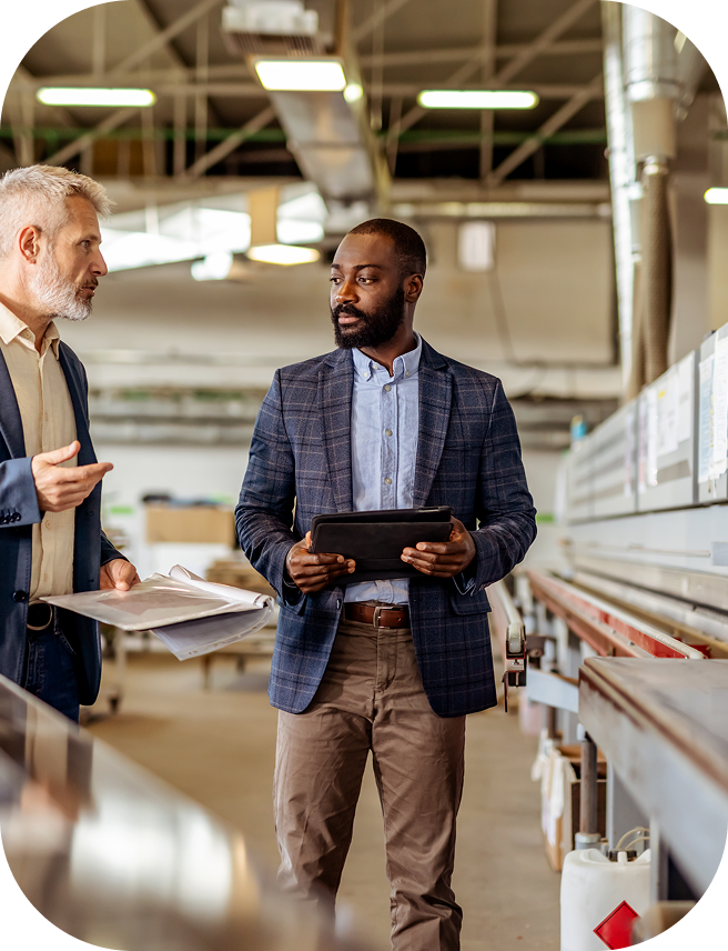 A graphic with images of a bridge and of a man walking with his laptop against a bright orange shape.  